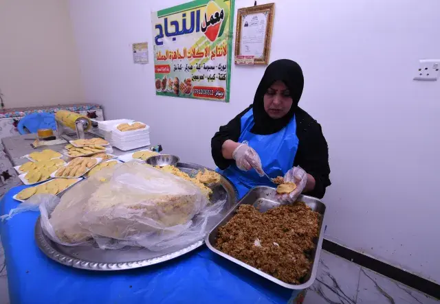 Woman making Iraqi Kibbeh