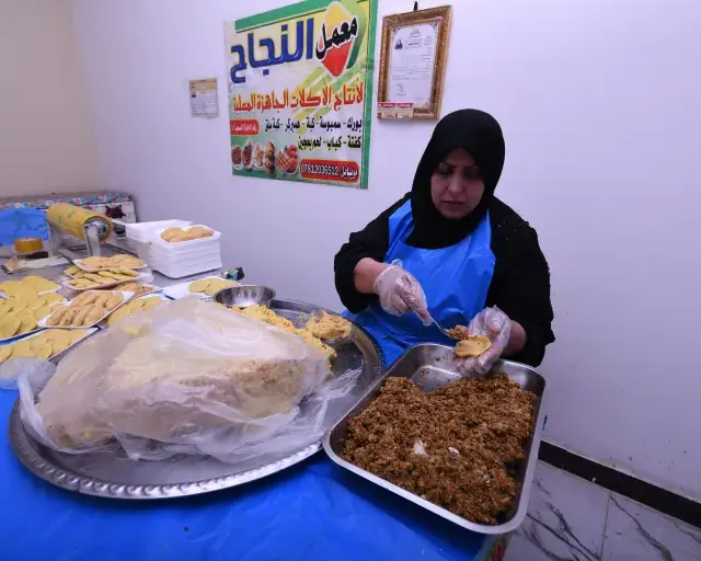 Woman making Iraqi Kibbeh